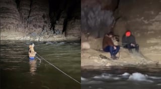 Illustration de l'article : 2 hommes traversent des eaux d&eacute;cha&icirc;n&eacute;es pour secourir un Berger Allemand coinc&eacute; sur une pente et se retrouvent pi&eacute;g&eacute;s pendant des heures