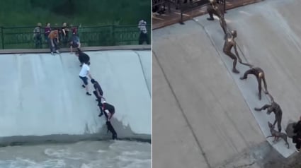 Illustration : Une &oelig;uvre d'art en bronze immortalise le sauvetage d'un chien tomb&eacute; dans un canal par une cha&icirc;ne humaine 10 ans plus t&ocirc;t